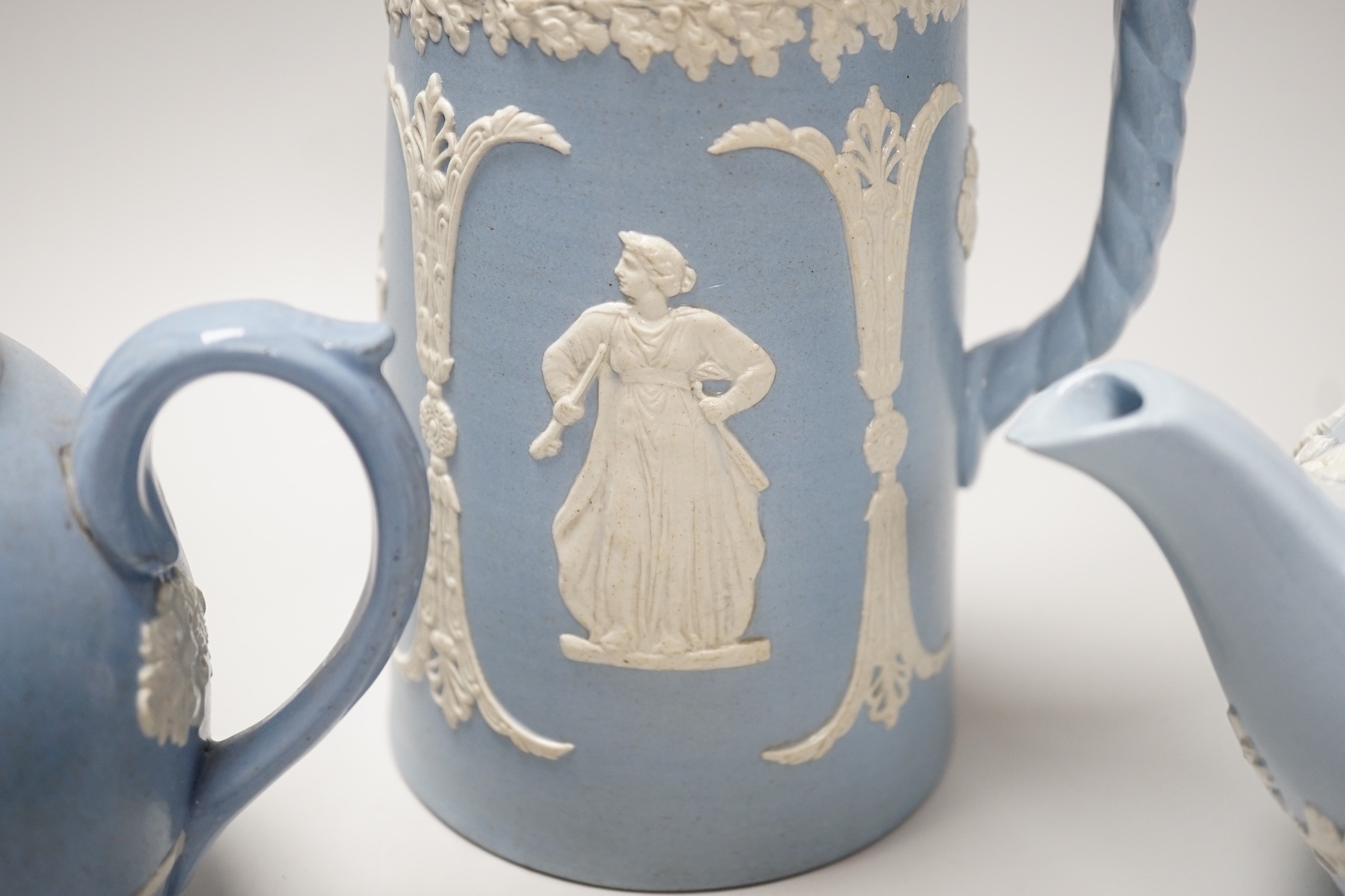 A group of Wedgwood and Wedgwood style jasperware teapots and jugs.